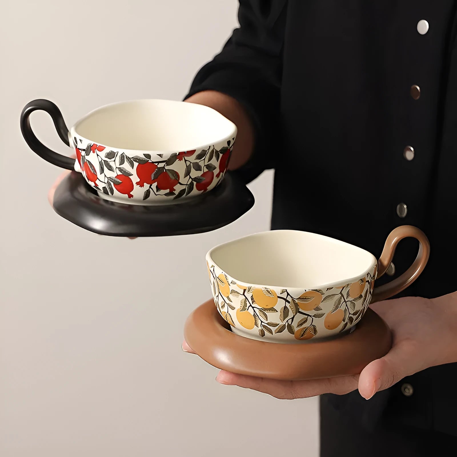 Antique style ceramic coffee cup and saucer set in black or orange medieval design, 210ml capacity.