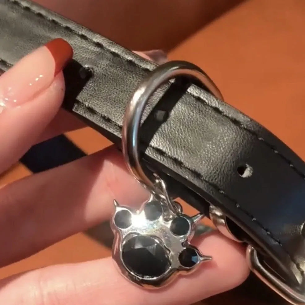 Black leather pet collar with small bell pendant for cats and small dogs