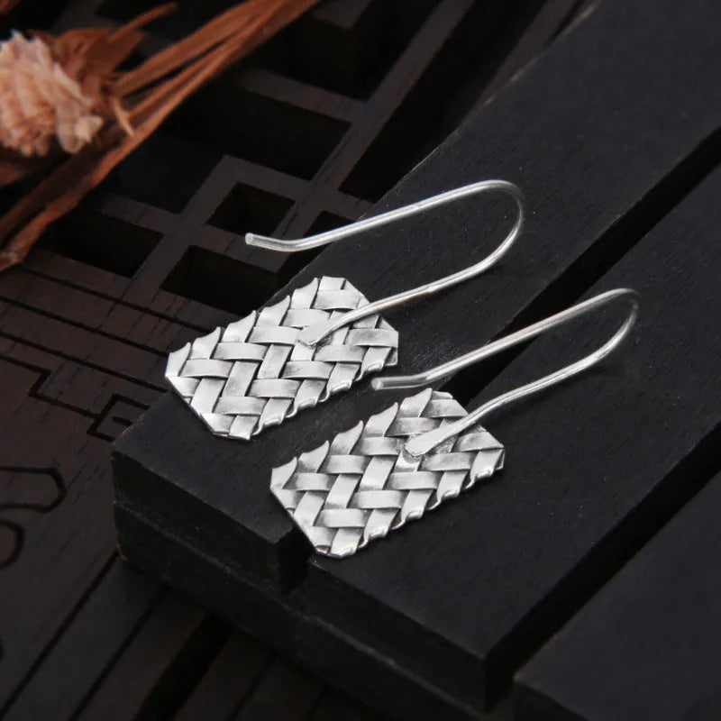 Women's silver 925 sterling silver woven diamond plaid geometric earrings showing textured pattern