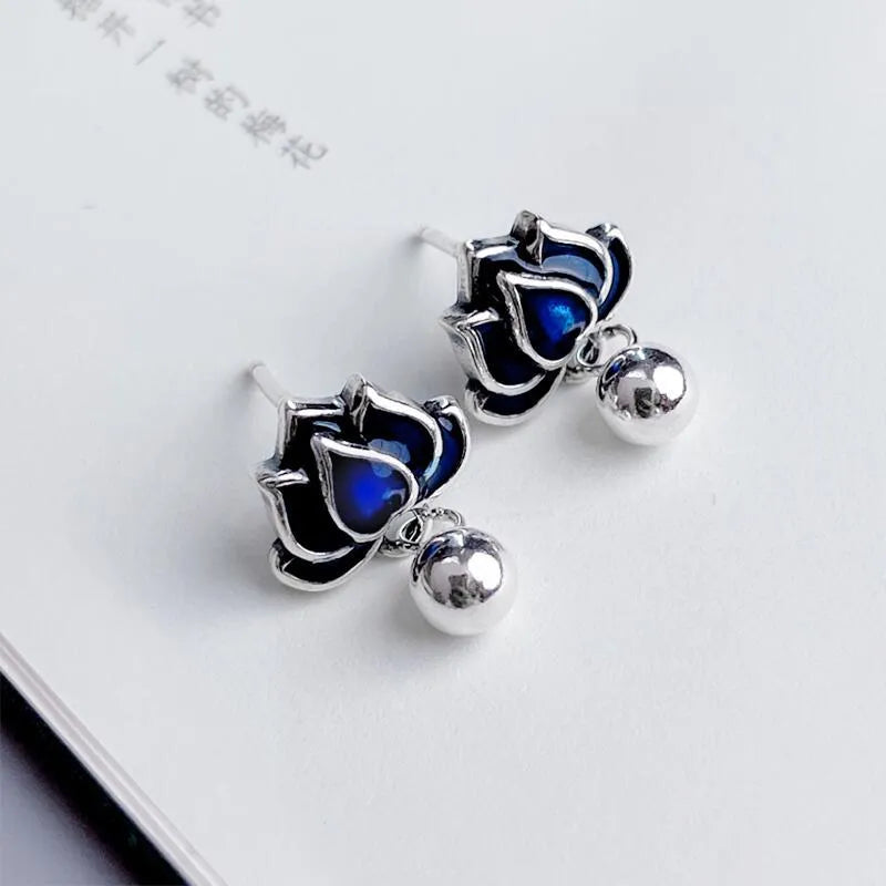 Blue lotus earrings with seedpod tassel design, silver alloy floral ear studs