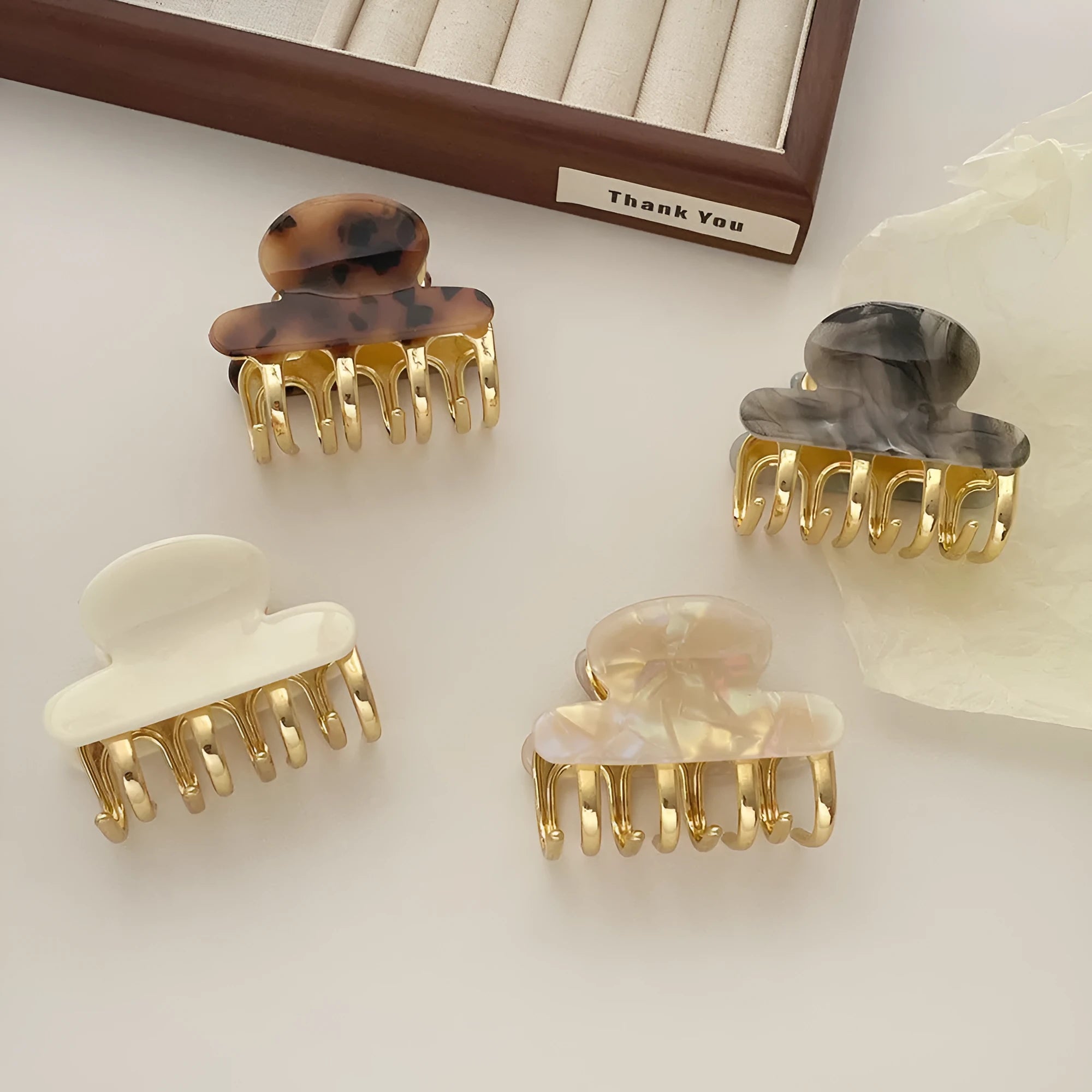 Retro acetate hair grip with metal clamp in medium size, showing irregular pattern on surface