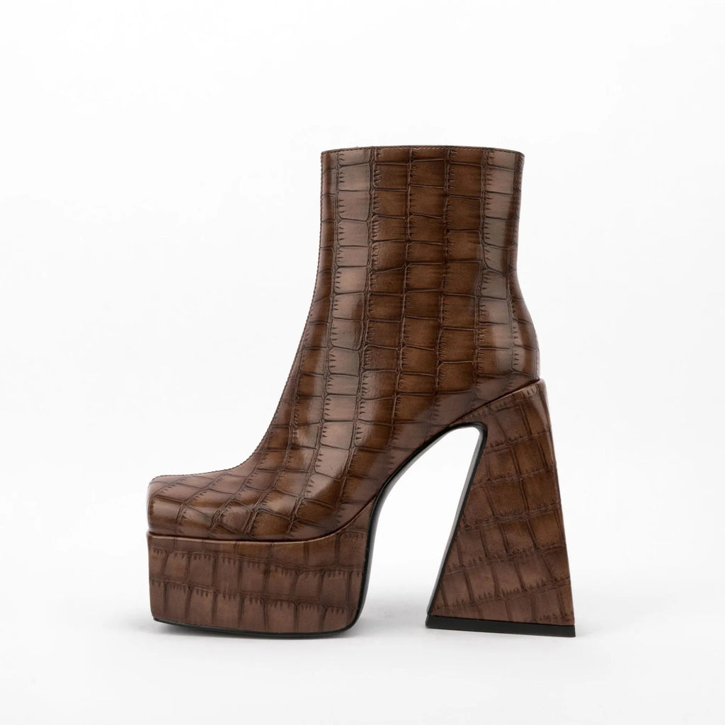 Women's artificial PU ankle boots with super high heels, shown in solid colours.