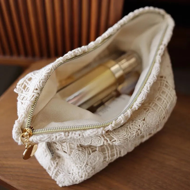 Handmade crocheted cosmetic bag with hollow floral embroidery on corduroy fabric in rope colour