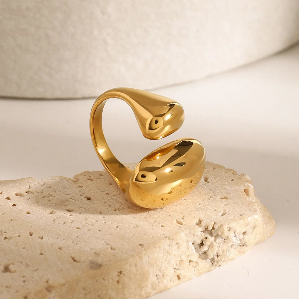 Women's geometric open ring in stainless steel with electroplated finish showing exaggerated angular design