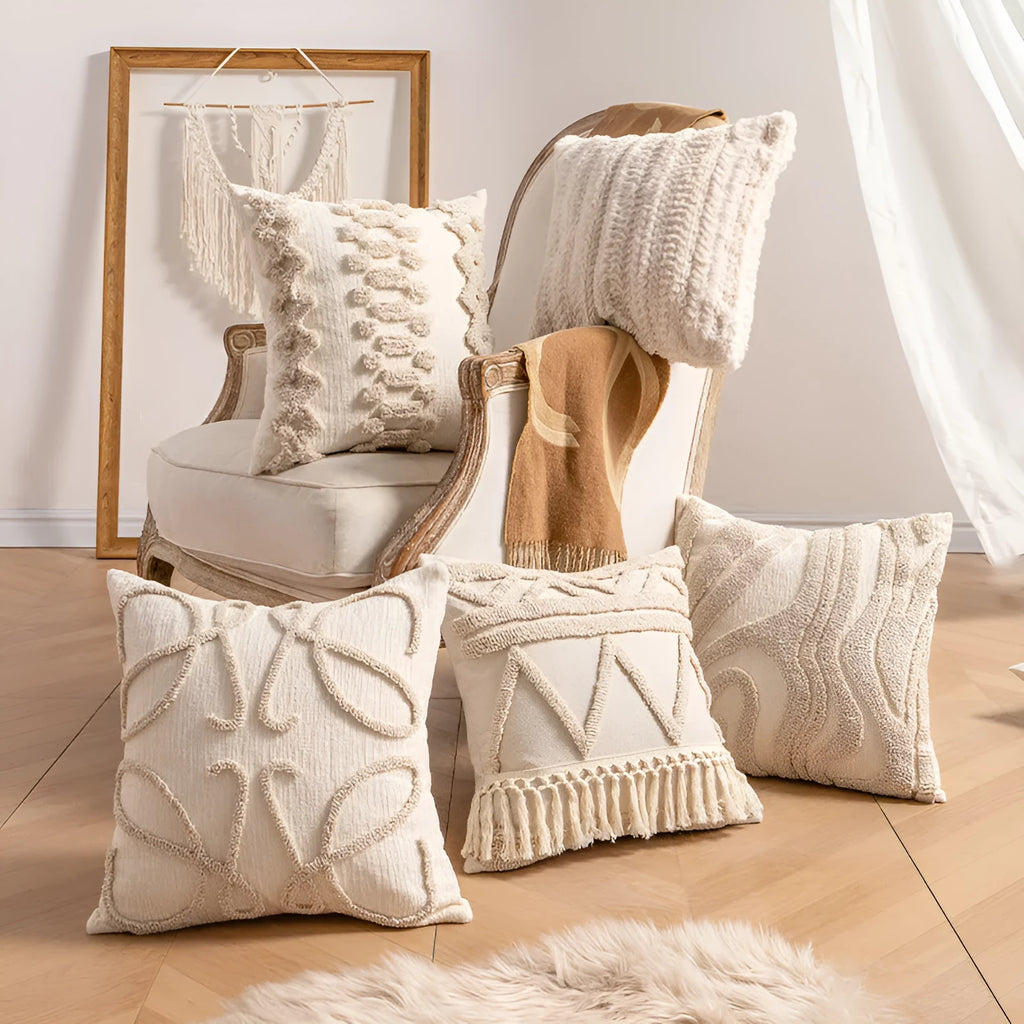 Knitted decorative pillow cover with tassels in a striped print design.