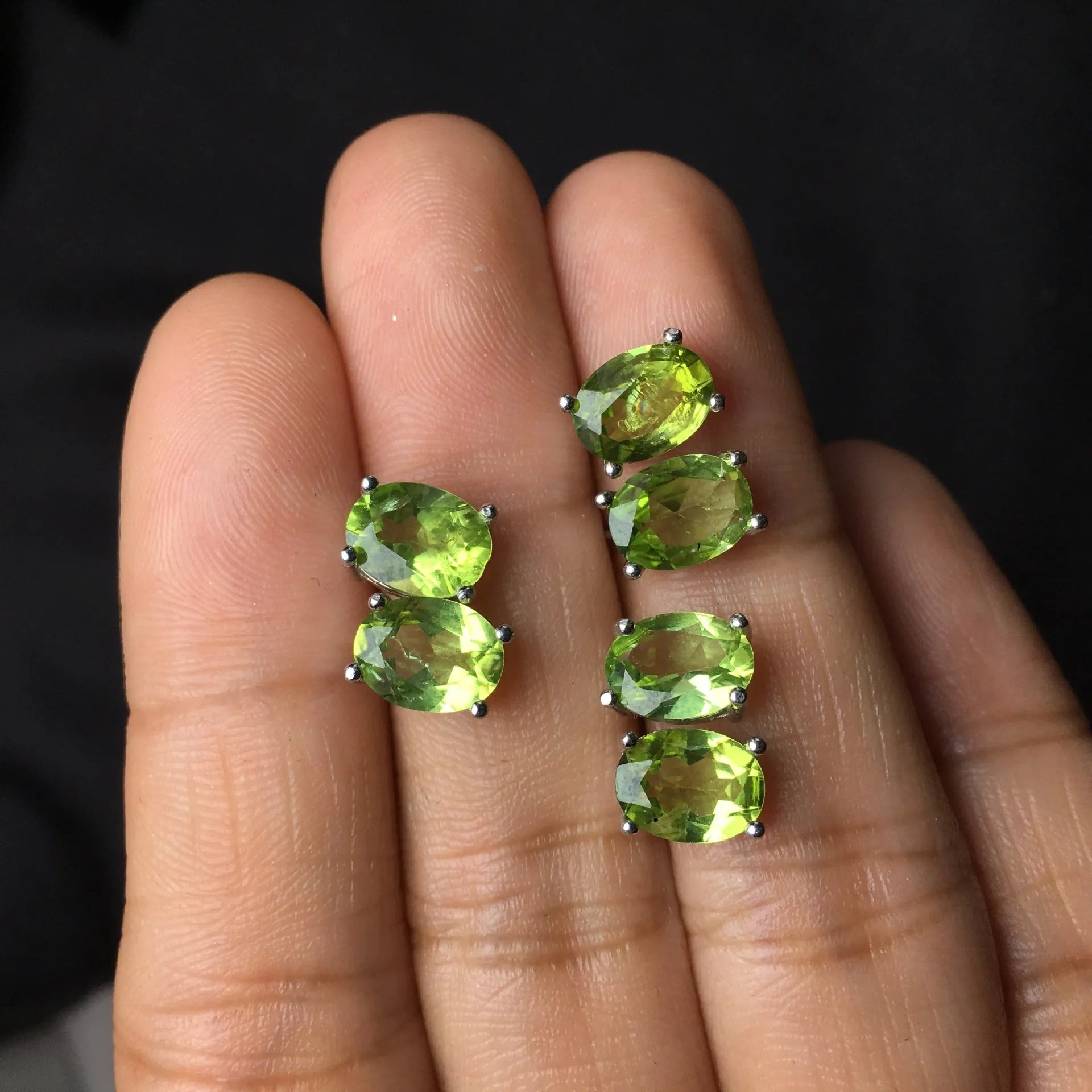 Grass green olivine stud earrings with S925 silver setting and geometric oval stone.