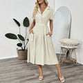 Light green women's twill shirt dress with lapel collar, fitted waist, and a chest pocket.