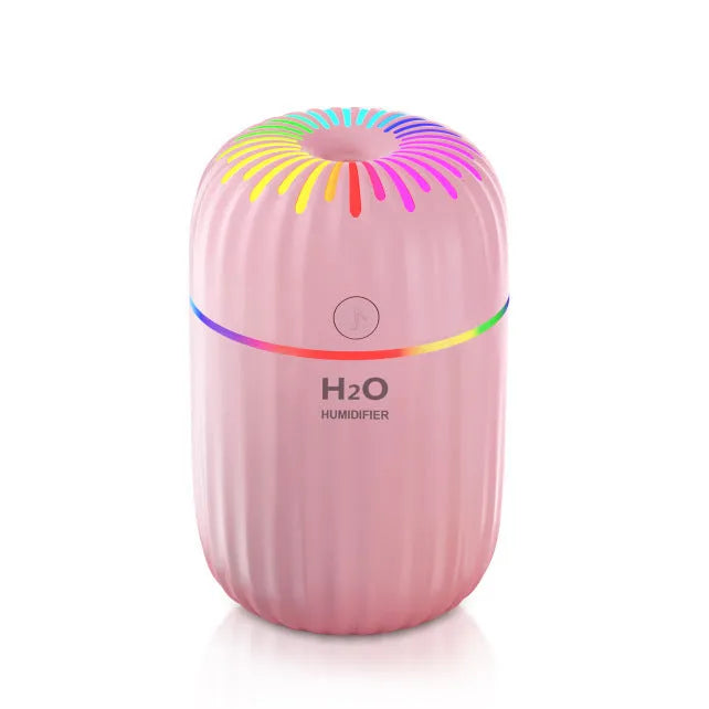 Mini green animal-shaped USB humidifier for car or desk use with cable.