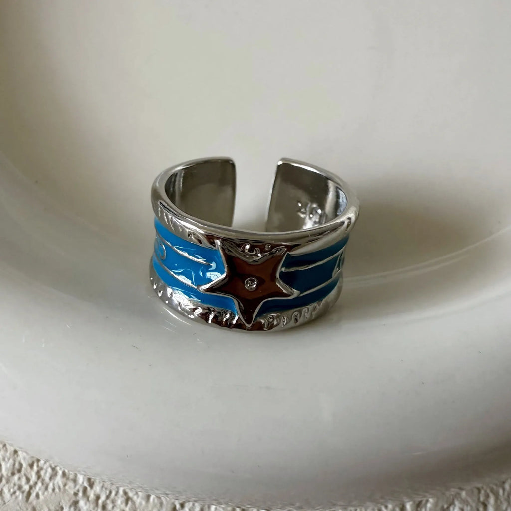 Adjustable geometric drop oil ring for women in copper with distressed finish and lines pattern
