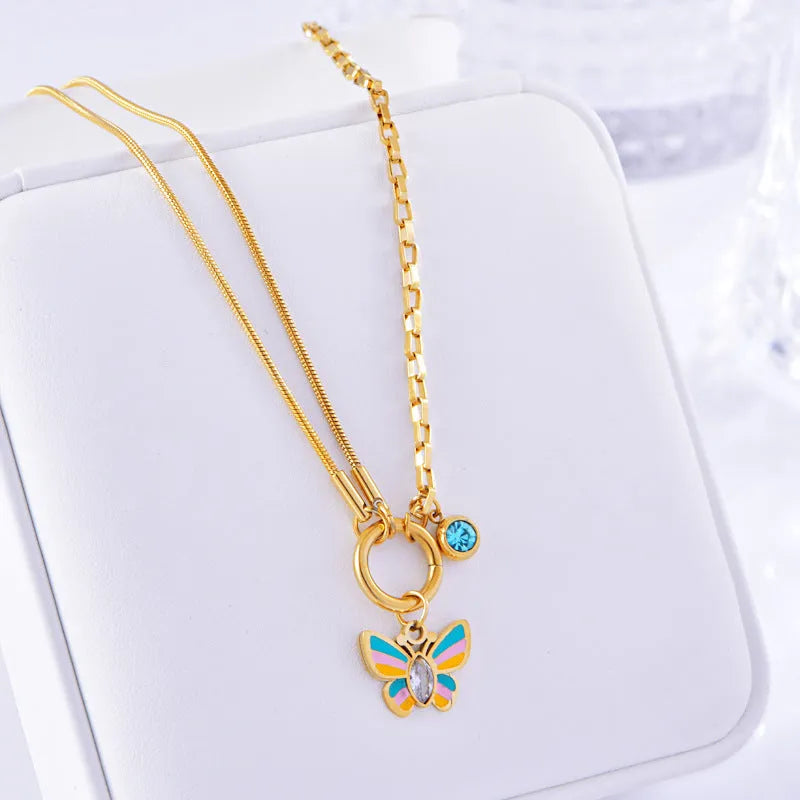 Gold titanium steel butterfly jewellery set with colourful epoxy pendant on snake bones chain