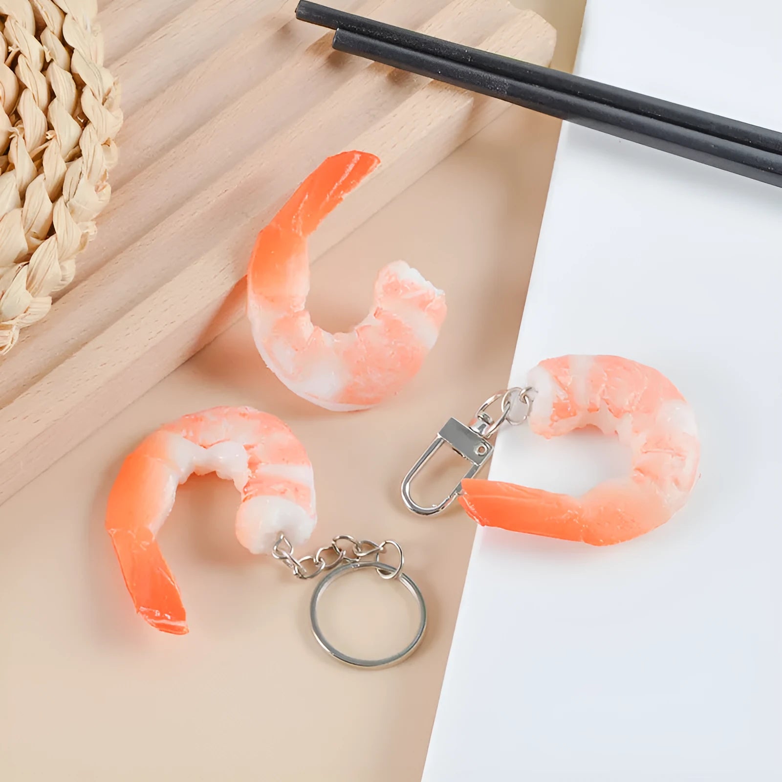 Realistic PVC shrimp-shaped keychain with door buckle attachment on white background.