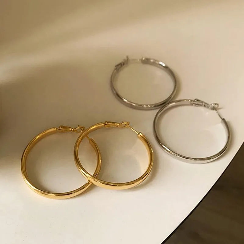 40mm diameter gold and silver metal circle hoop earrings on copper base