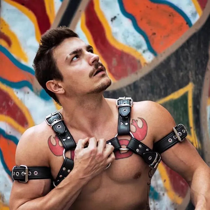 Black leather chest muscle bondage strap with metal buckle adjustment for adult shoulder harness