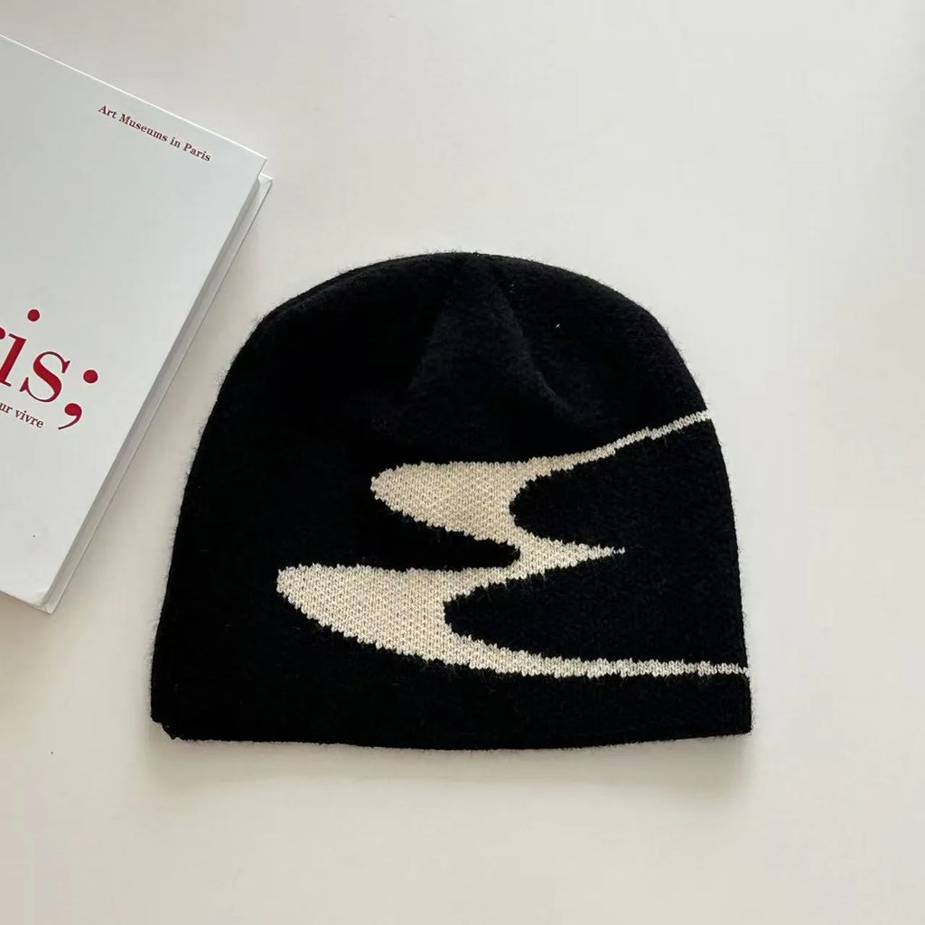 Unisex acrylic knitted beanie hat in black, shown flat.