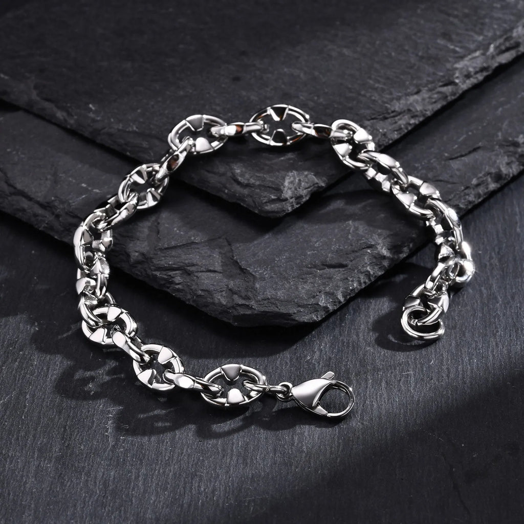 Thick stainless steel geometric chain bracelet for men, shown in steel colour.