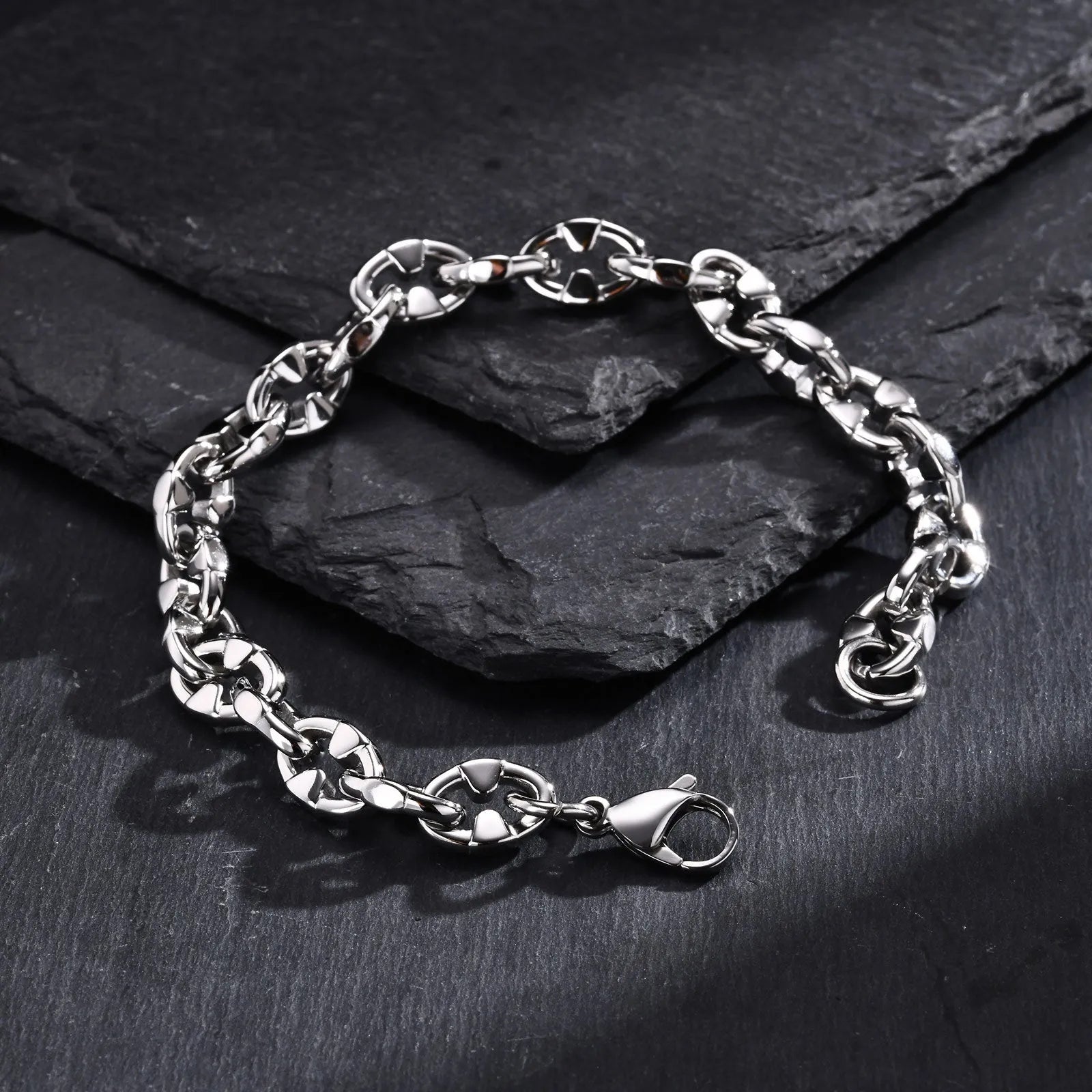 Thick stainless steel geometric chain bracelet for men, shown in steel colour.