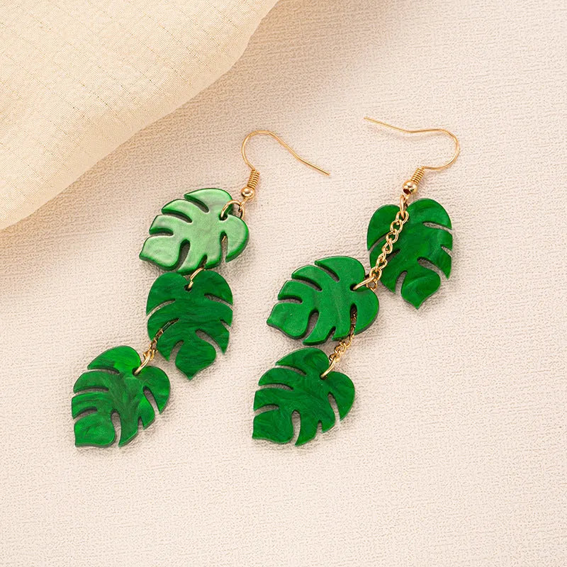 Drop-shaped acrylic earrings with summer coconut design in five colour variations on alloy ear hooks