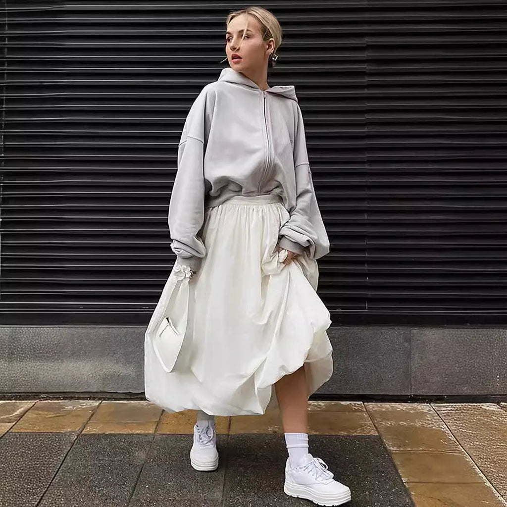 Women's solid colour cotton long skirt with elasticated waistband in black and white.