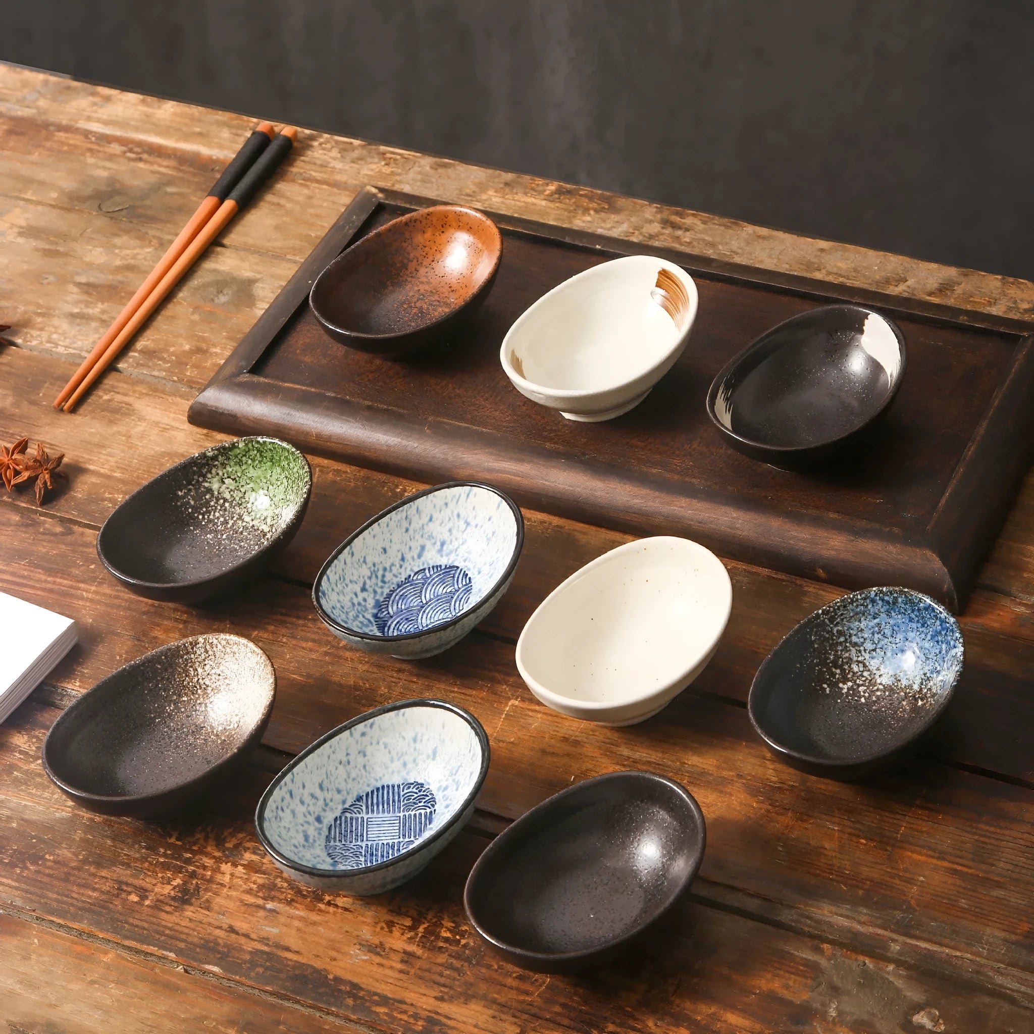 Oval Japanese ceramic sauce dipping bowl with traditional underglaze pattern