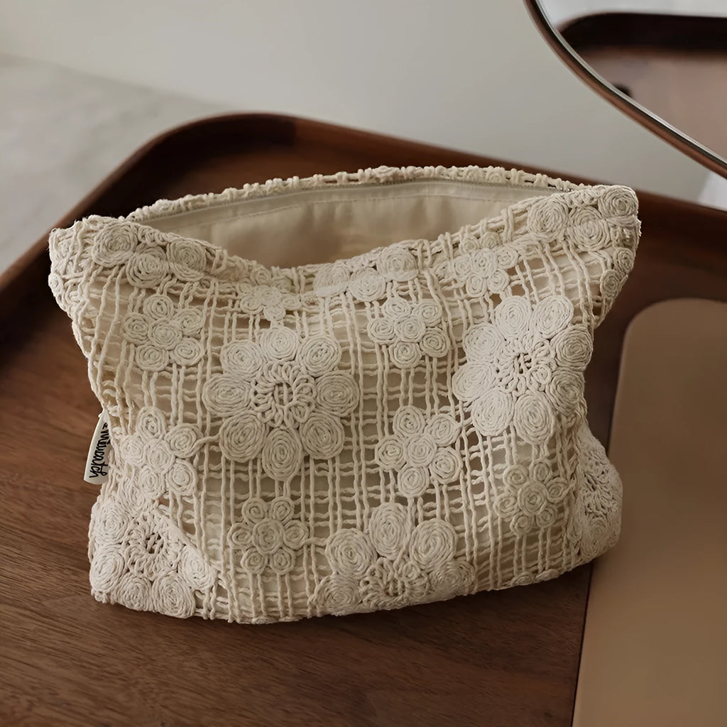 Handmade crocheted cosmetic bag with hollow floral embroidery on corduroy fabric in rope colour