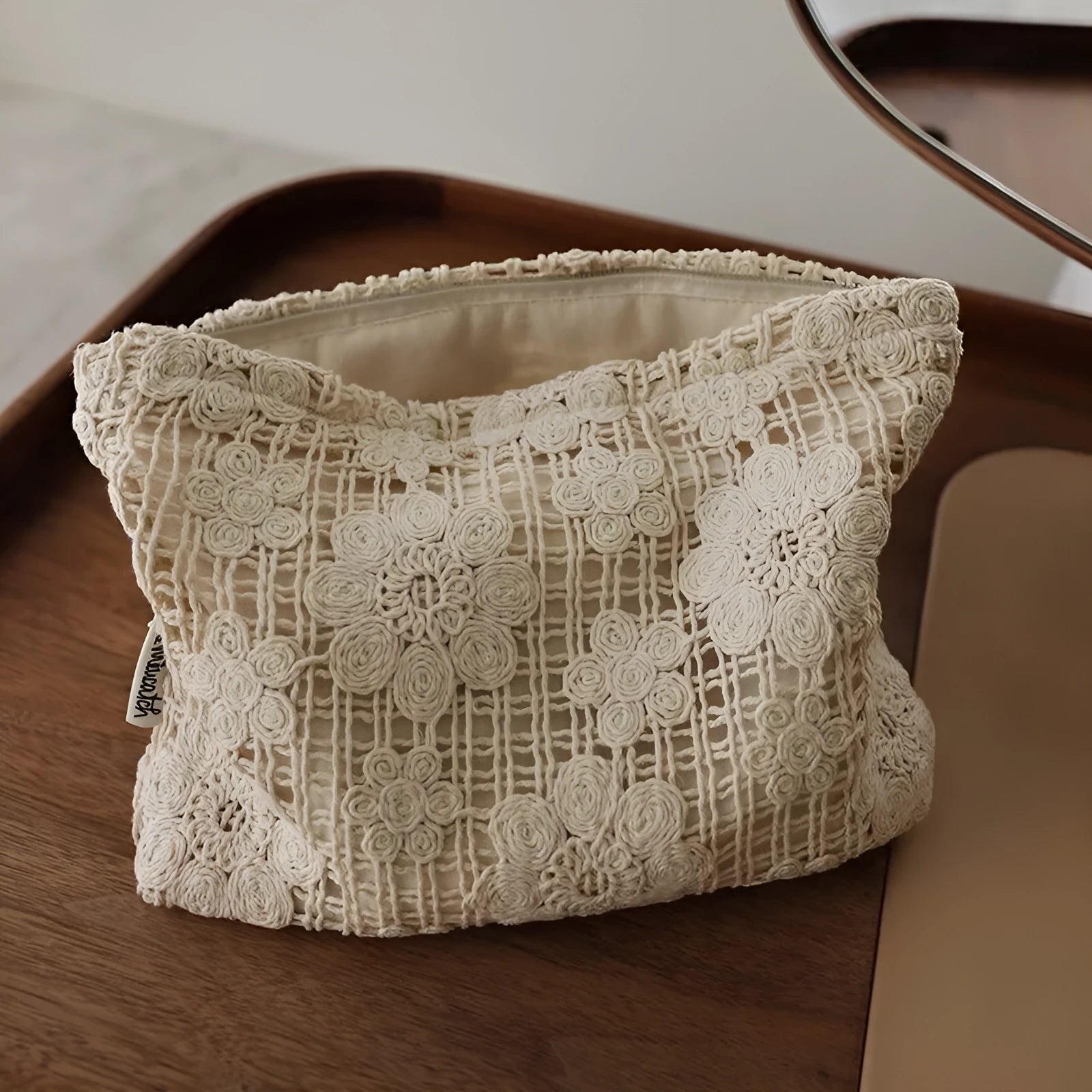 Handmade crocheted cosmetic bag with hollow floral embroidery on corduroy fabric in rope colour