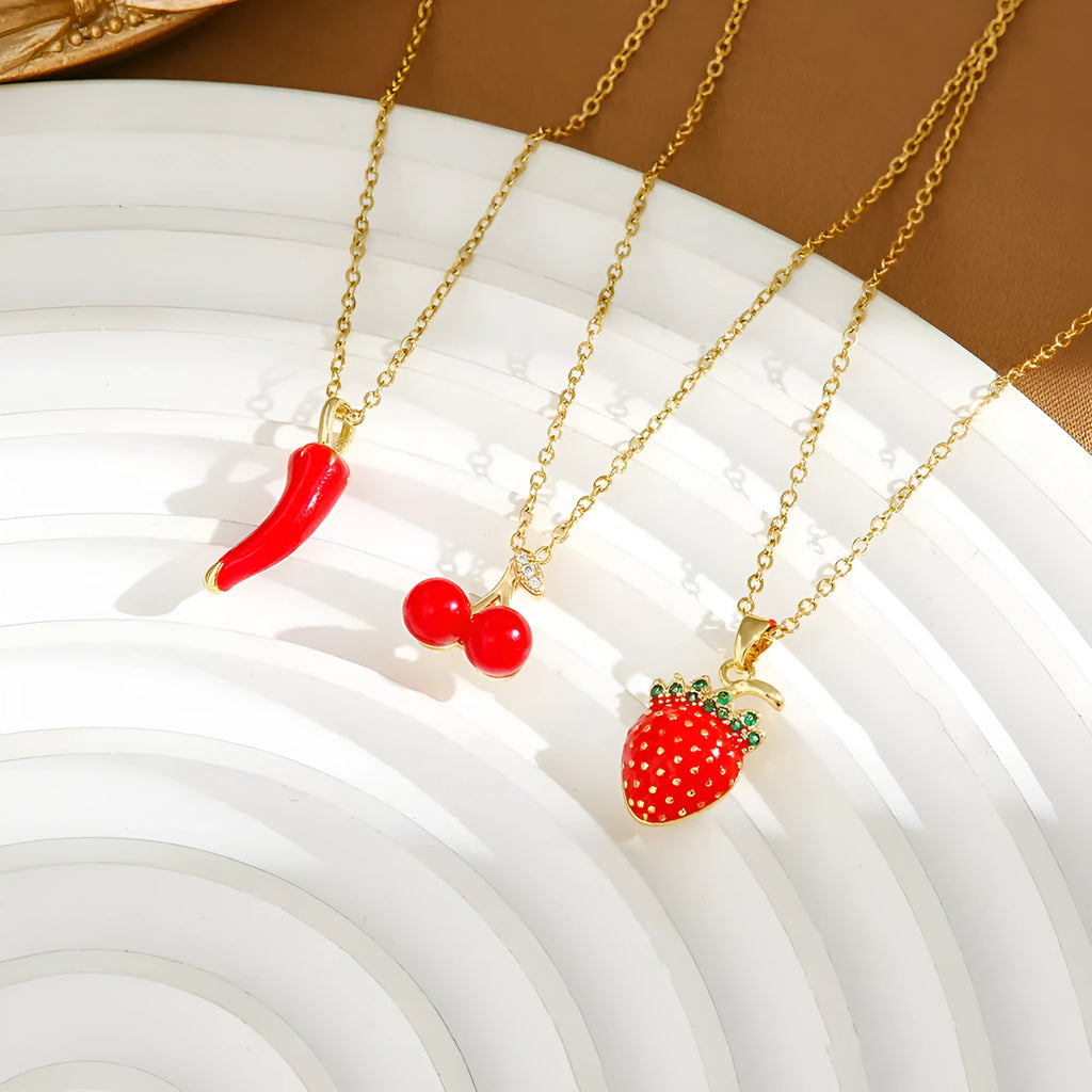 Titanium steel necklace with indie cherry, strawberry, and pepper motif pendant on an O-ring chain.