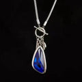 Women's long necklace with geometric pendant on snake bone chain in blue, champagne or grey