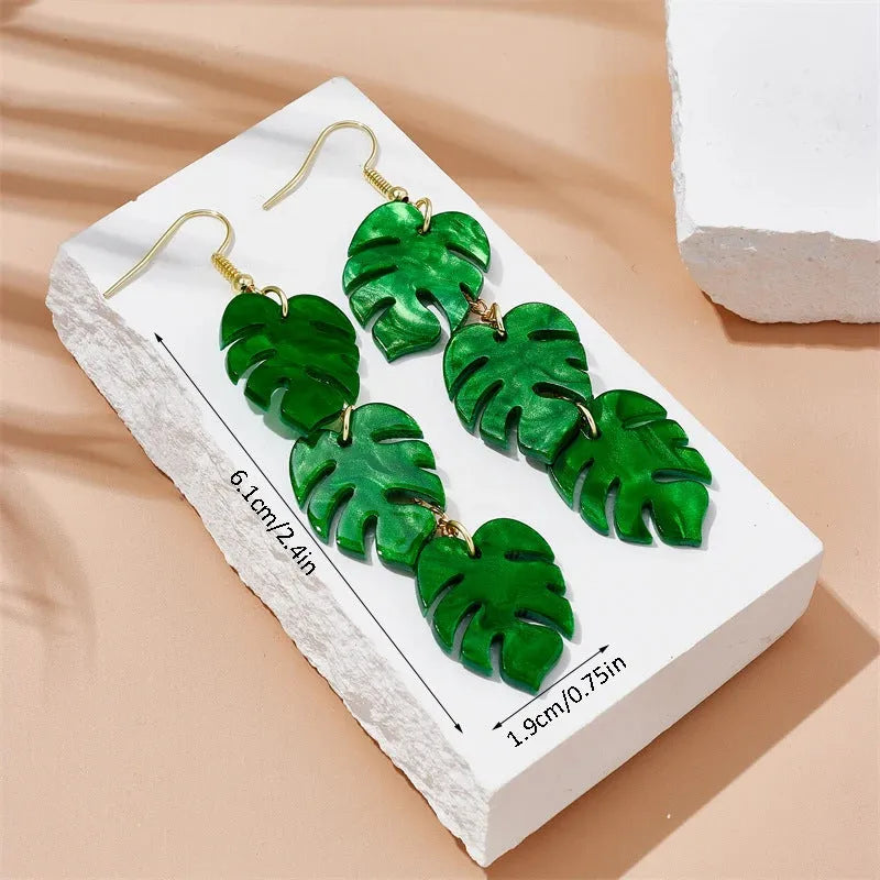 Drop-shaped acrylic earrings with summer coconut design in five colour variations on alloy ear hooks
