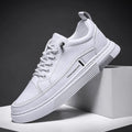 Men's low-top skate shoes in black with microfiber upper, rubber sole, and elastic band.
