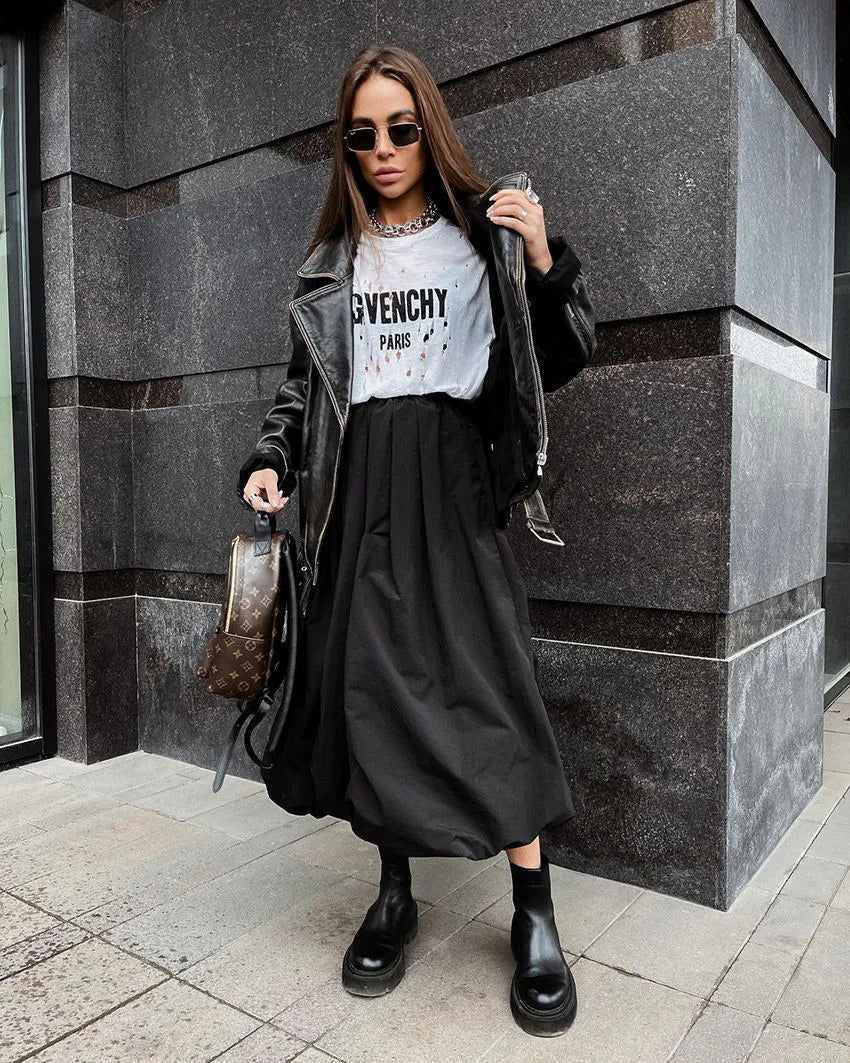 Women's solid colour cotton long skirt with elasticated waistband in black and white.