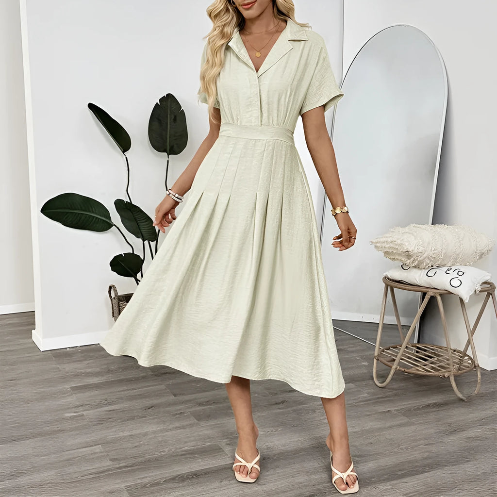 Light green women's twill shirt dress with lapel collar, fitted waist, and a chest pocket.