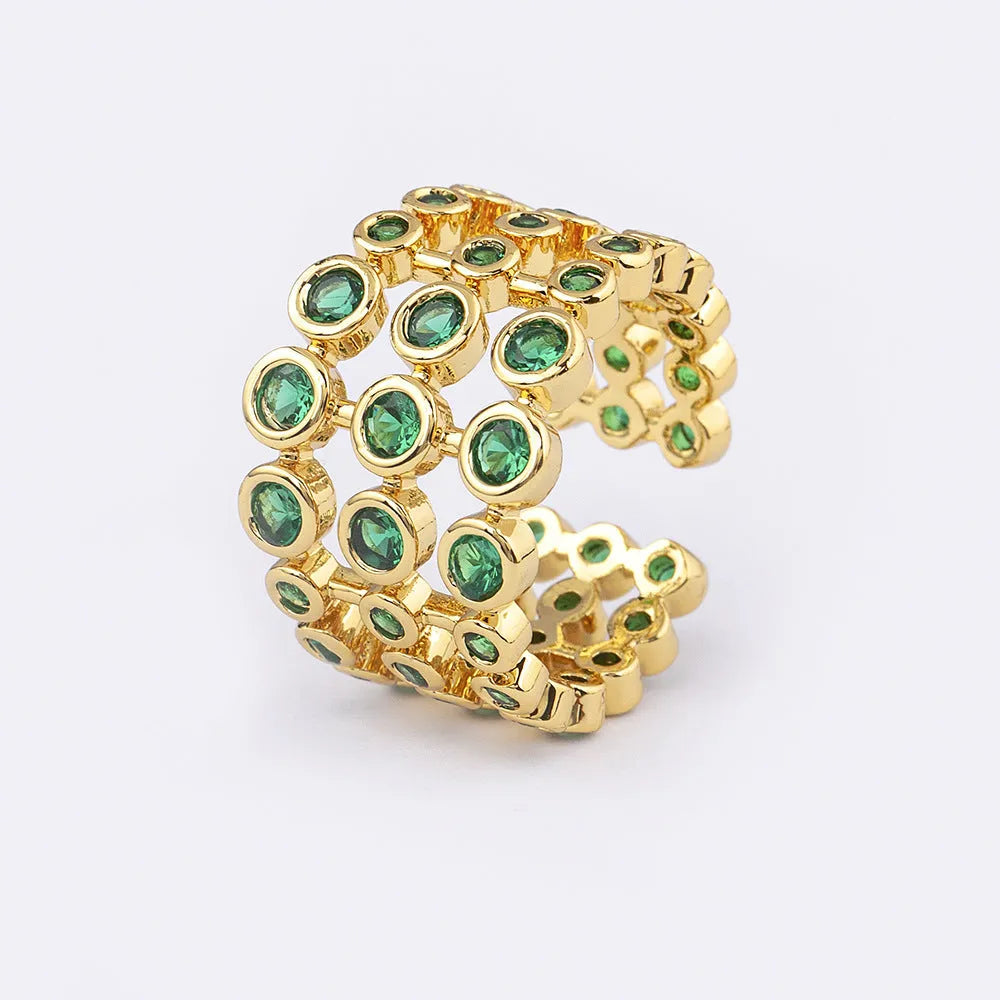 Copper ring with gold plating and green zircon stones in wide band design