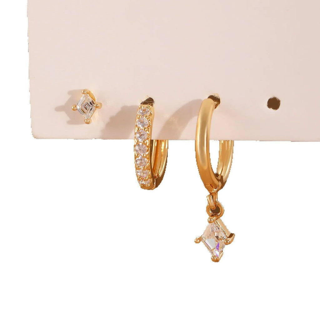 Gold and white geometric earring set with zircon stones showing three earring types: dangling, stud, and clasp.