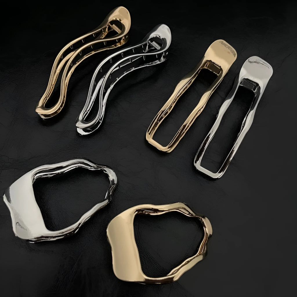 Gold and silver geometric zinc alloy hair clips showing arc, square, and triangle shapes