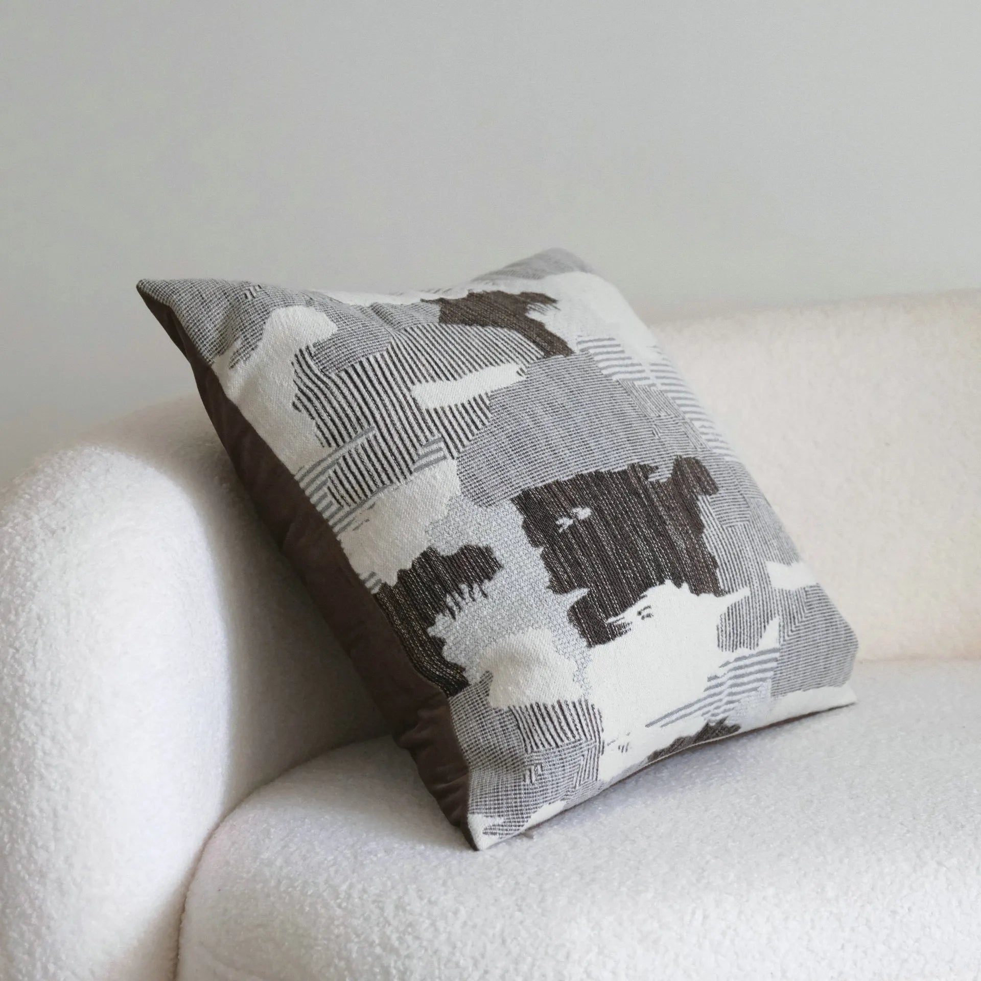 Coffee brown striped Chinese classical style sofa cushion on a living room sofa.