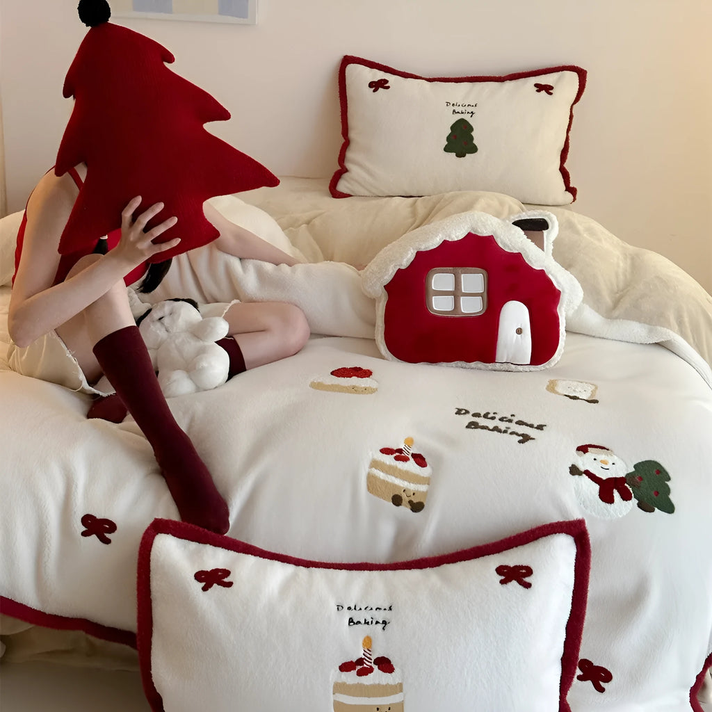 Girl's Heart cartoon pattern four-piece bedding set with winter Christmas theme on bed