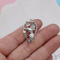 Alloy magpie bird pendant charm with electroplated finish on a white background.