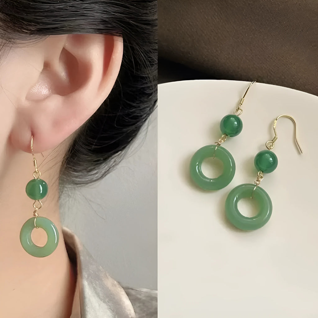 Green and gold Chinese style peace buckle shape earrings with geometric ring design.