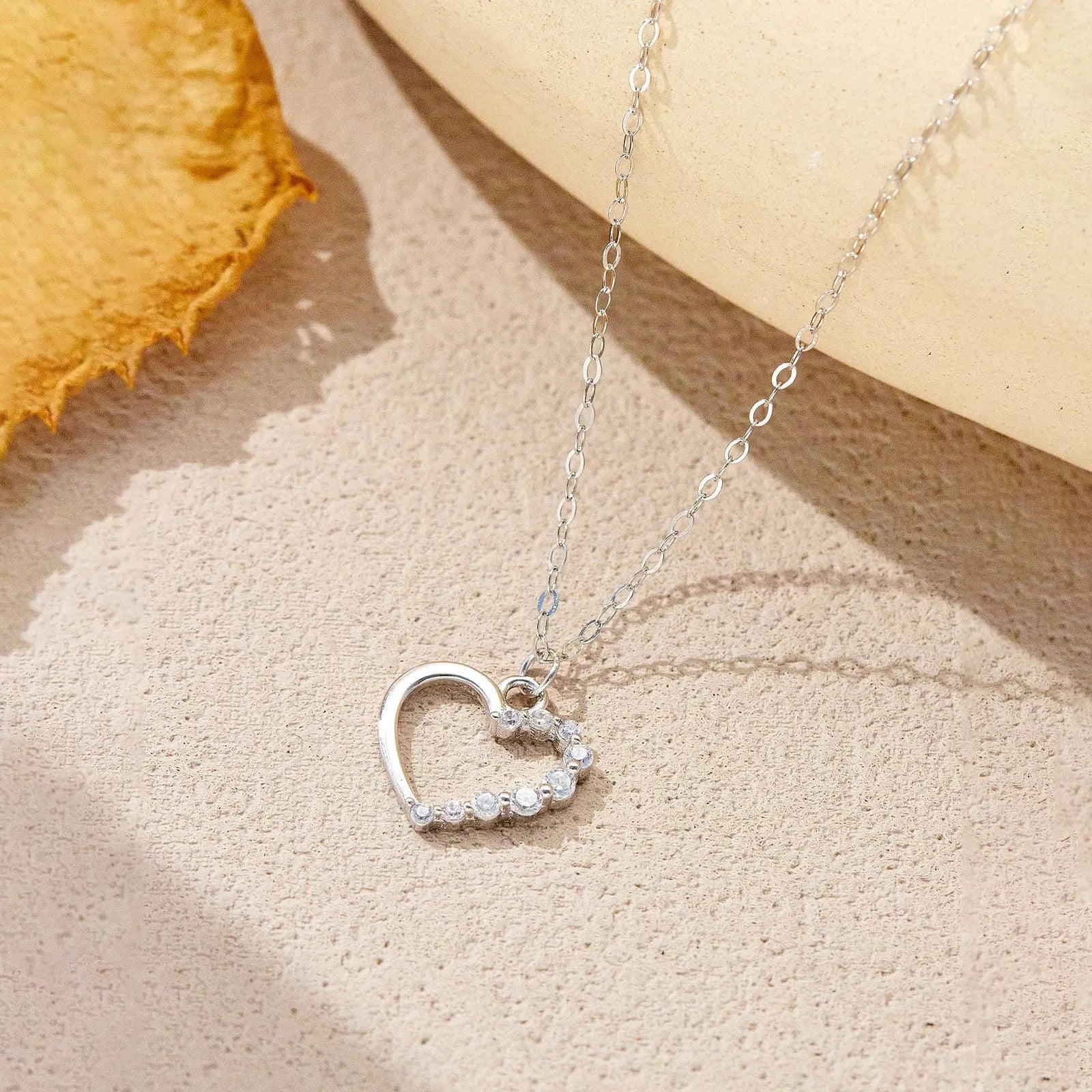 Sterling silver hollow heart necklace with regular chain in choice of colour finishes