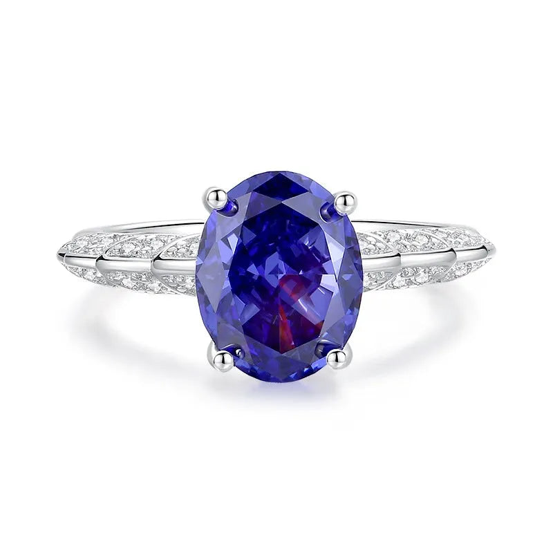 Close-up of a heart-shaped sterling silver ring with a high-carbon diamond ice cut coloured zircon stone.