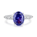 Close-up of a heart-shaped sterling silver ring with a high-carbon diamond ice cut coloured zircon stone.