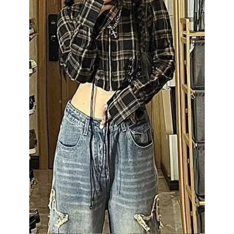 Blue high waist straight leg women's jeans on a hanger, showing the trouser length and front button detail.