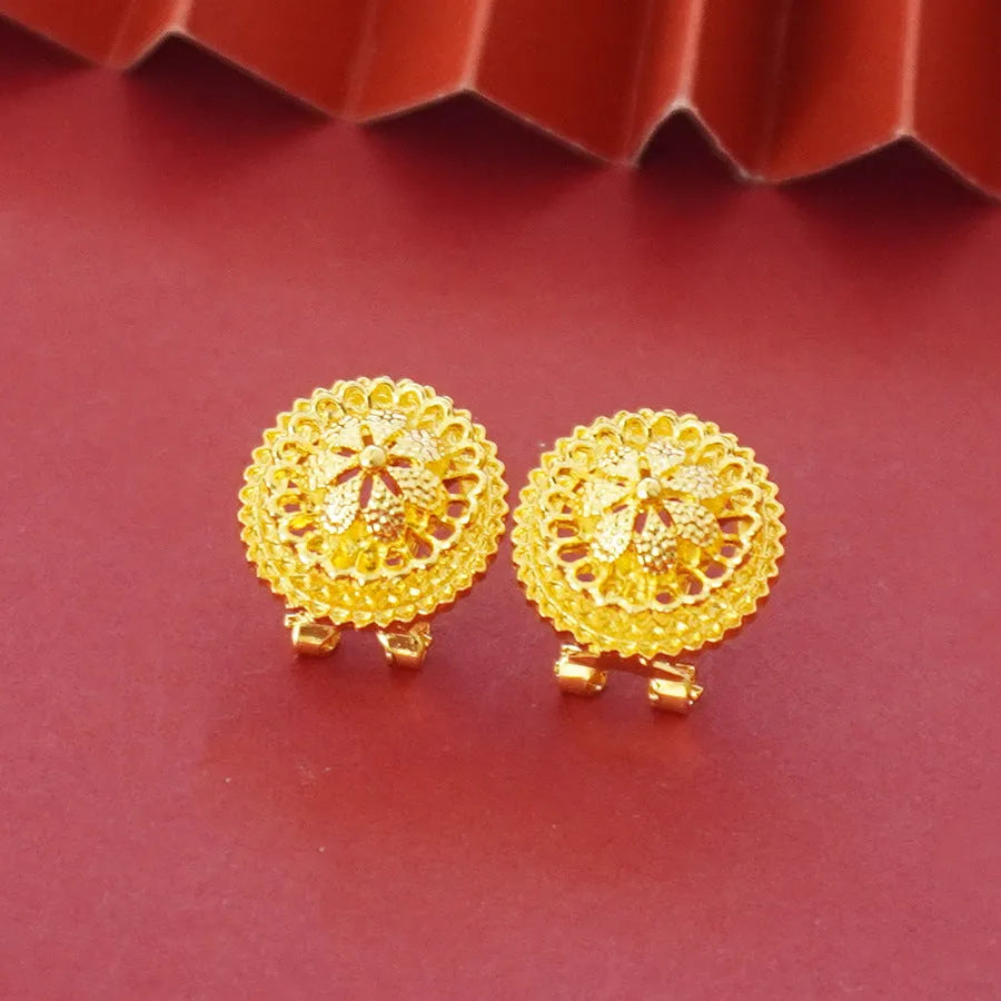 Gold electroplated three-piece jewellery set with floral designs, water wave chain necklace, matching earrings and ring