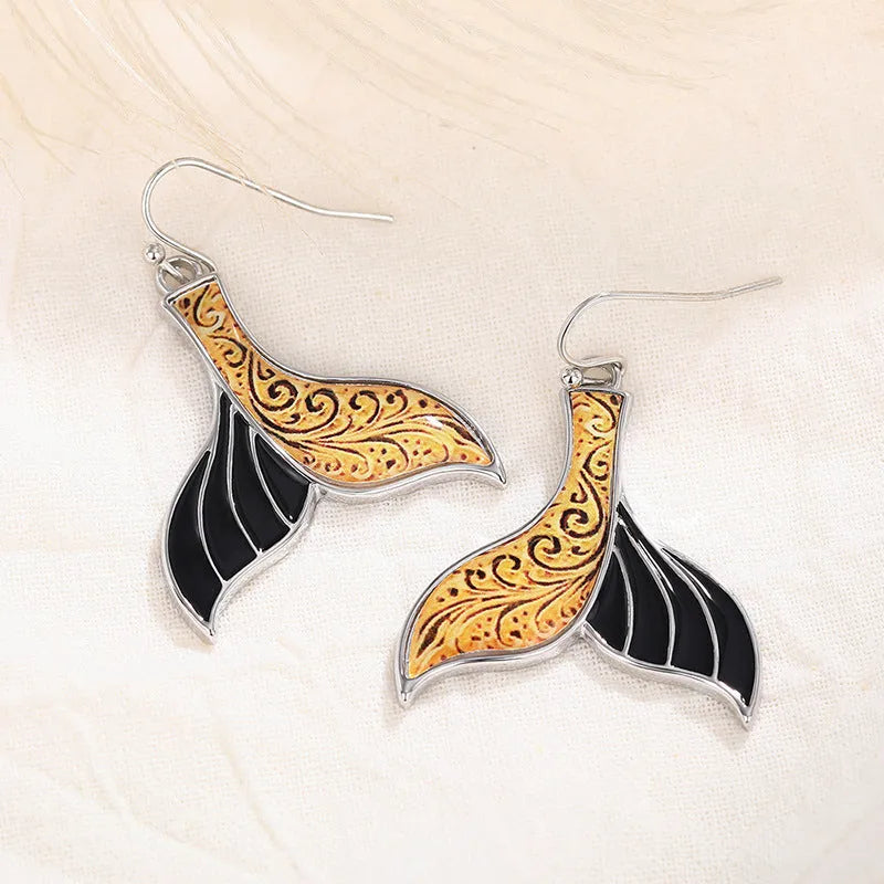 Women's white gold colour fishtail earrings with whale charm detail on alloy