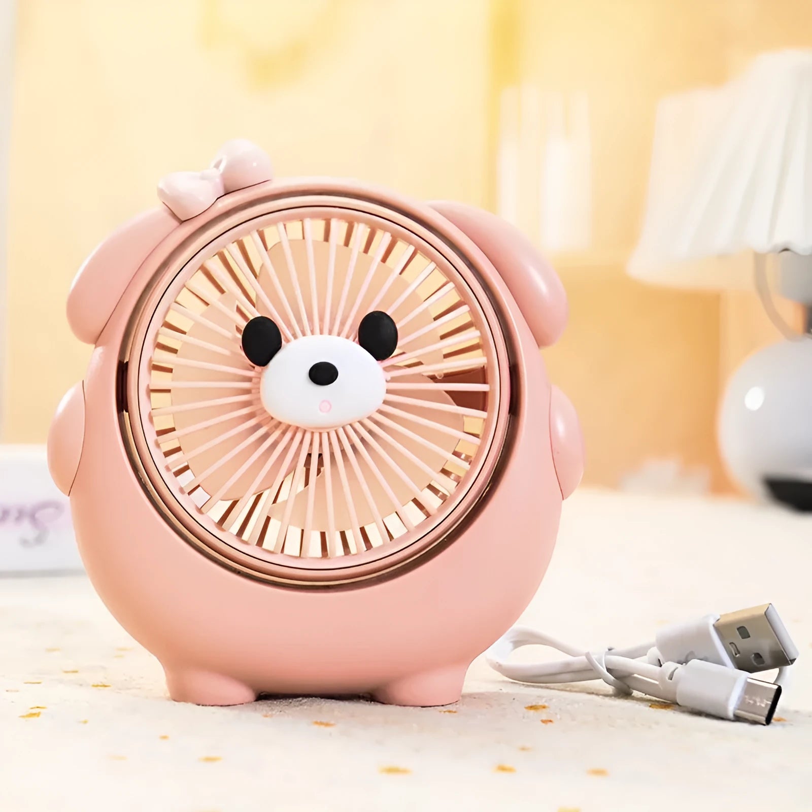 Cute dog-themed USB desktop electric fan in one of six colour options on a desk.