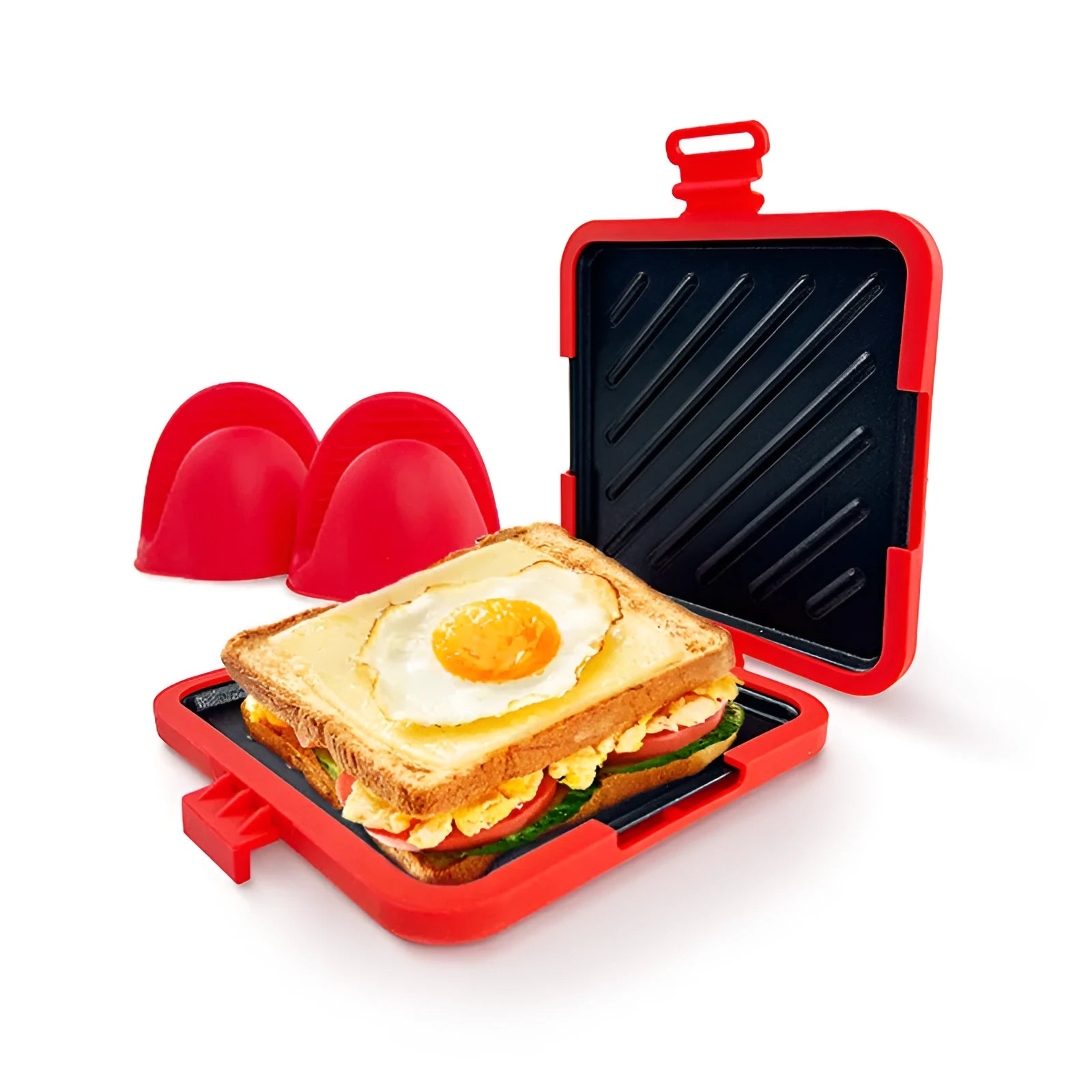 Red silicone baking tray with integrated handbag-style handles and matching oven gloves