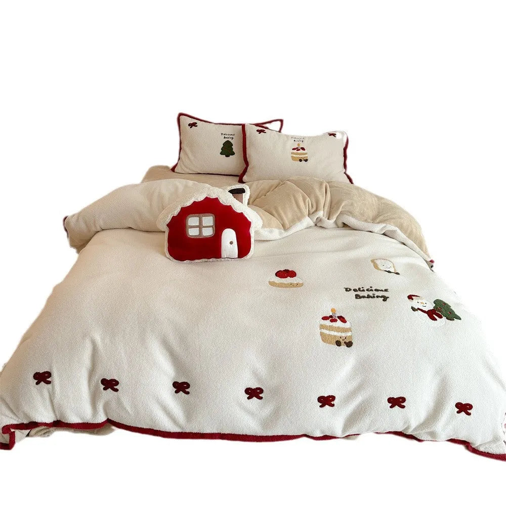 Girl's Heart cartoon pattern four-piece bedding set with winter Christmas theme on bed