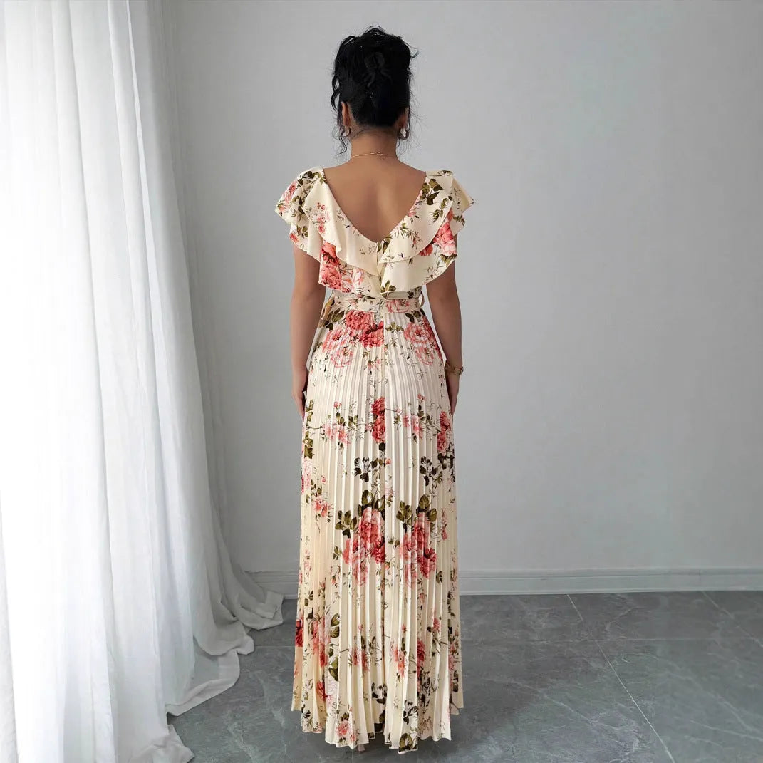 Apricot V-neck dress with digital floral print, ruffled short sleeves, and oversized pleated swing skirt.