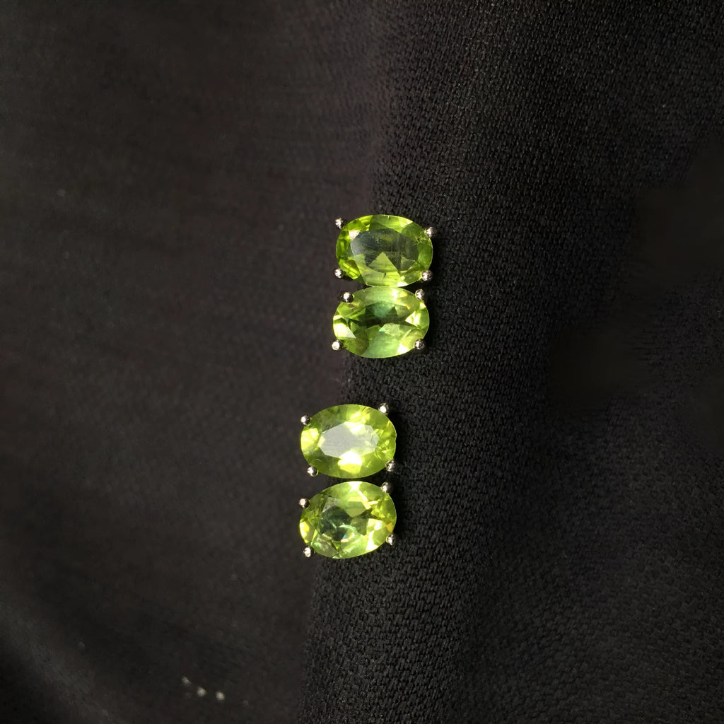 Grass green olivine stud earrings with S925 silver setting and geometric oval stone.
