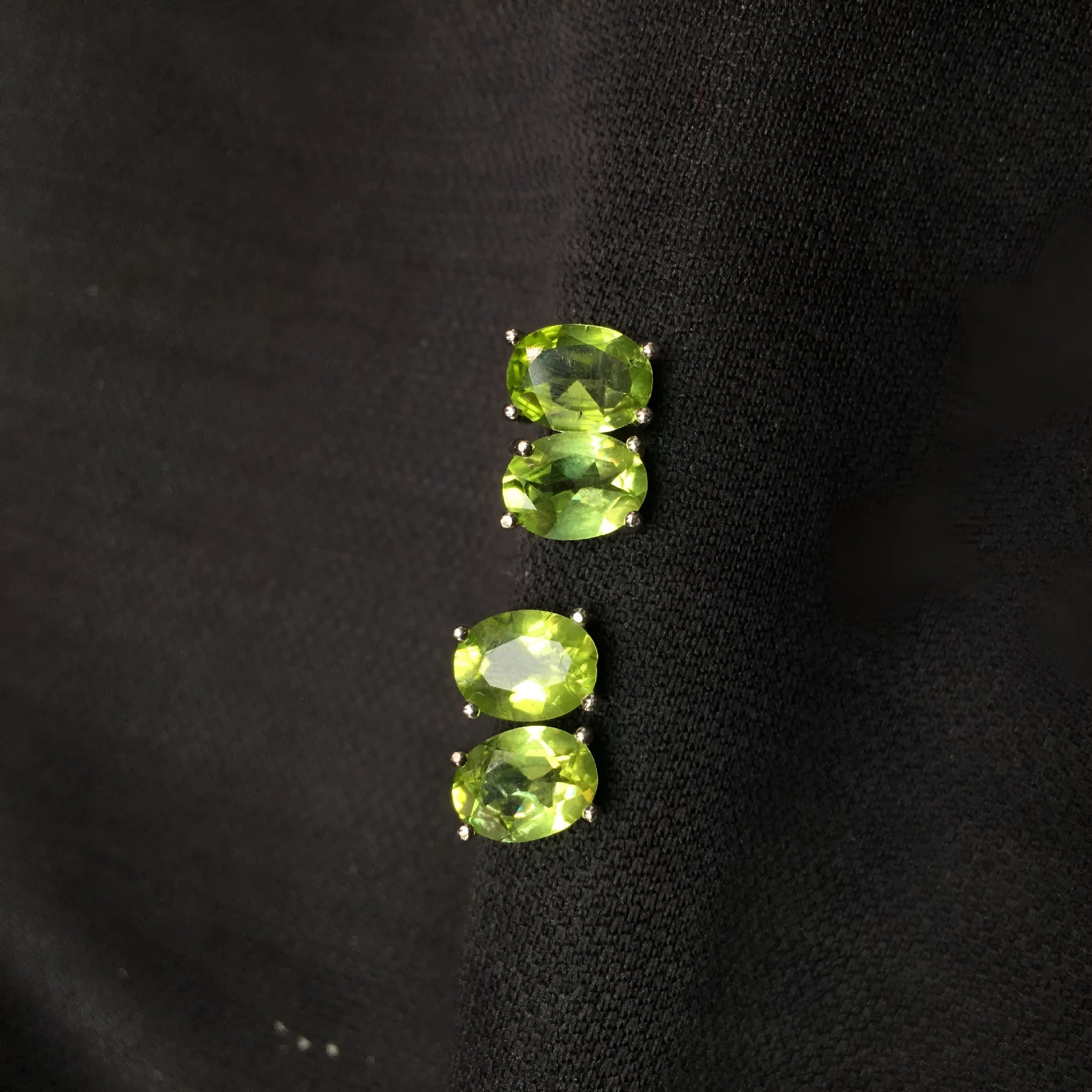 Grass green olivine stud earrings with S925 silver setting and geometric oval stone.